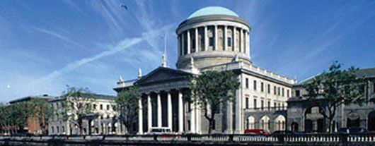 A large building with columns and a dome on top of it