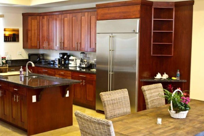 A kitchen with stainless steel appliances and wooden cabinets