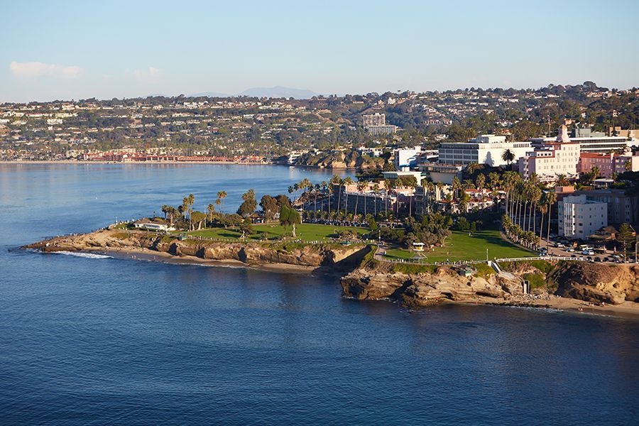 An aerial view of a large body of water with a city in the background
