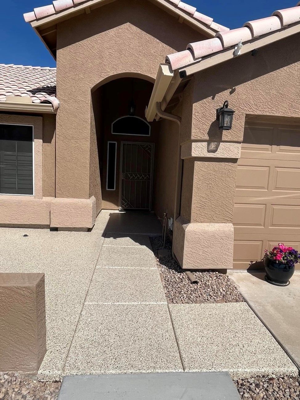 A house with a walkway leading to the front door