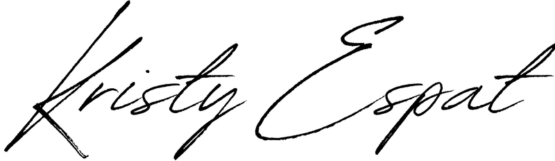 A black and white signature of kristy espat on a white background.
