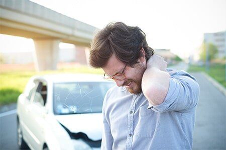 Car Accident Man Holding His Neck — Personal Injury in Port Huron, MI