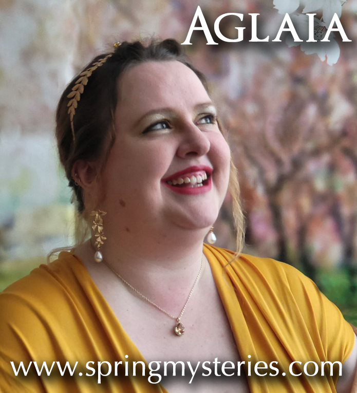 A woman wearing a yellow shirt is smiling and has the website www.springmysteries.com below her