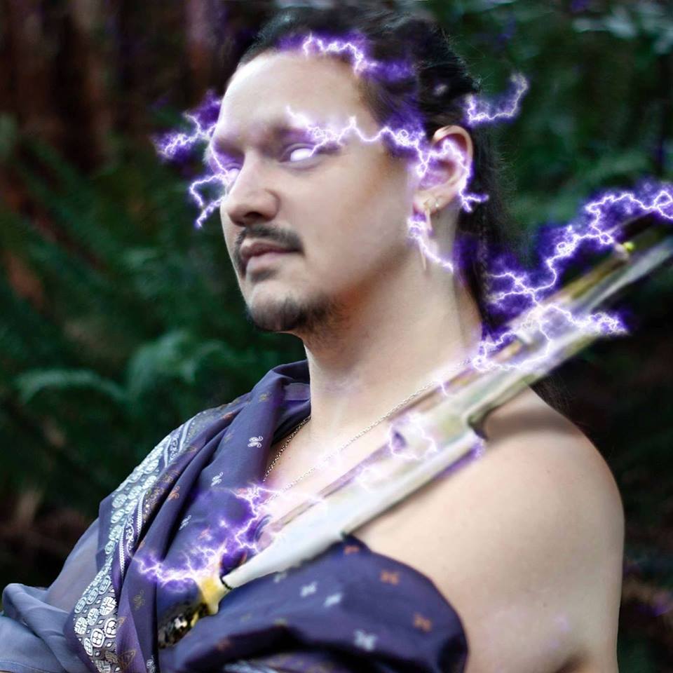 Man holding lightning bolt and wreathed in lightning bolts, representing Zeus.