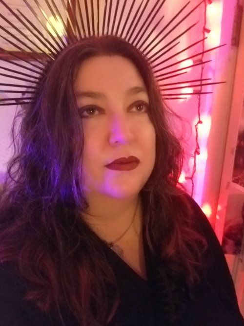 A woman is wearing a crown on her head.