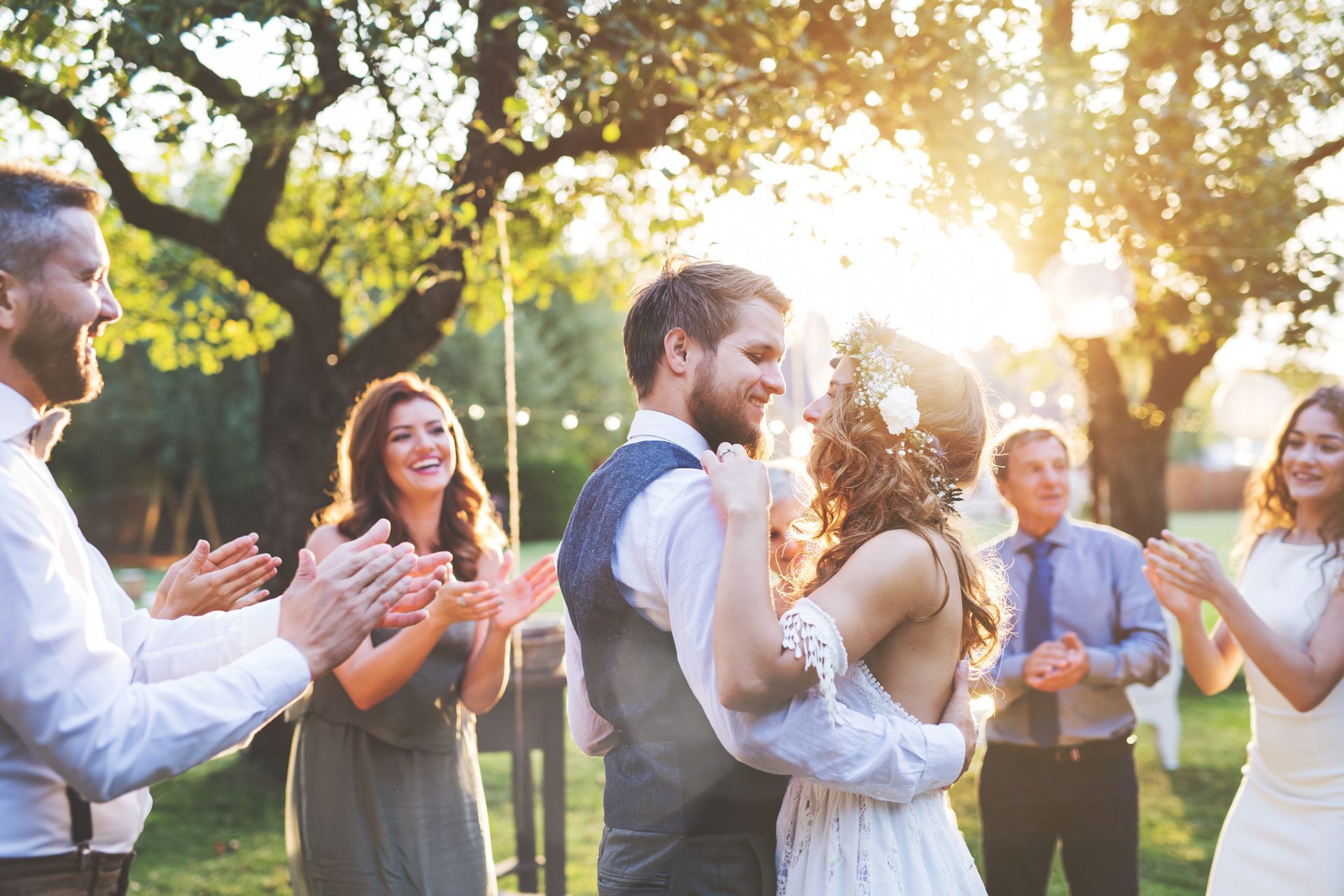 a bride and groom are dancing with their wedding guests at their wedding reception .