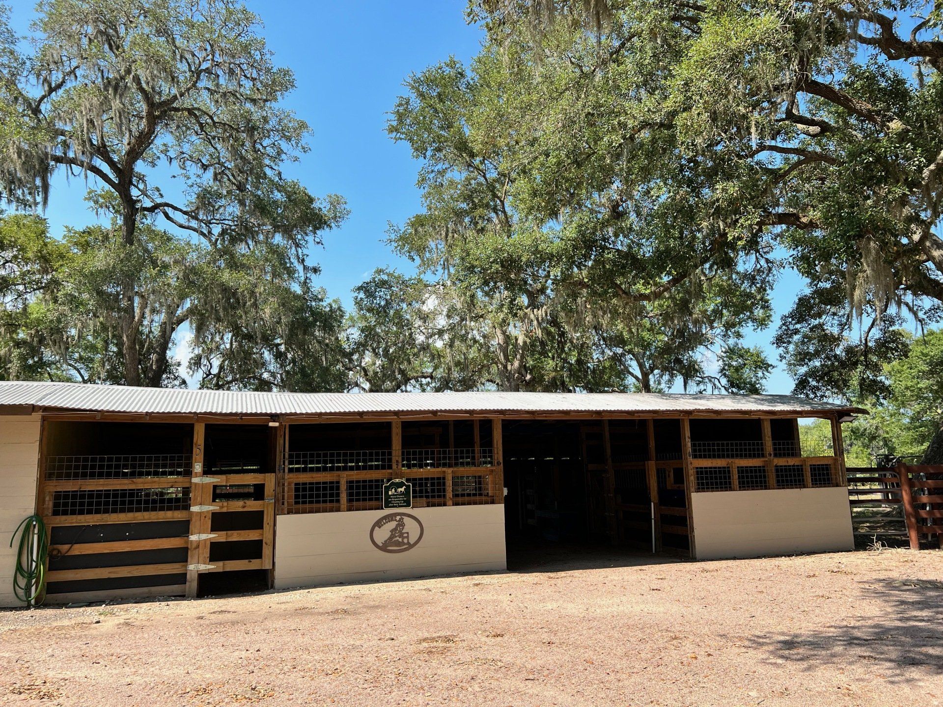 a horse stable with a sign that says a on it