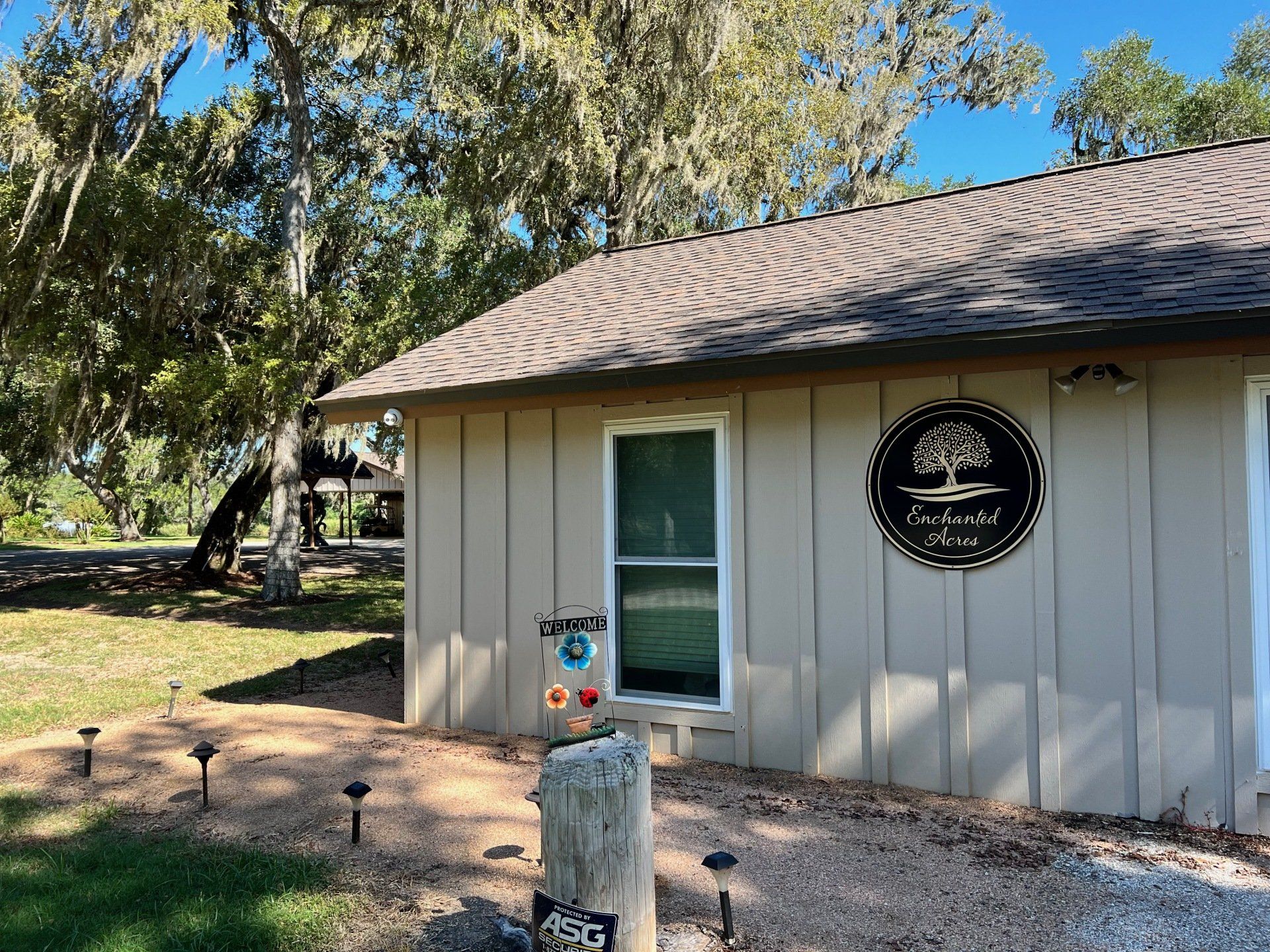 a small house with a sign on the side of it .