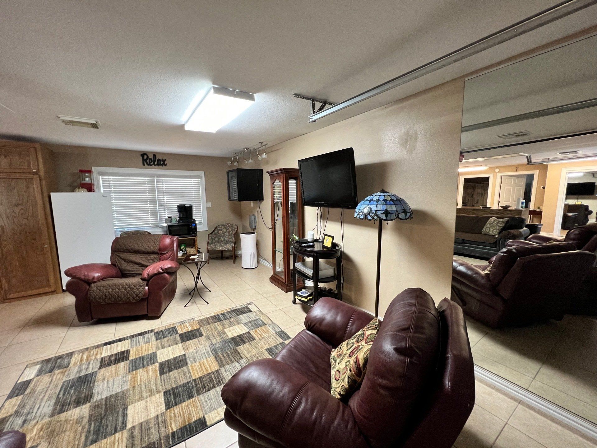 a living room filled with furniture and a television .