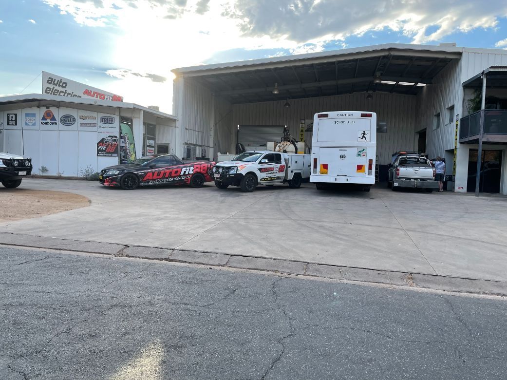 A Bunch Of Cars Are Parked In Front Of A Building — Autofit88 Auto Electrics In Ciccone, NT