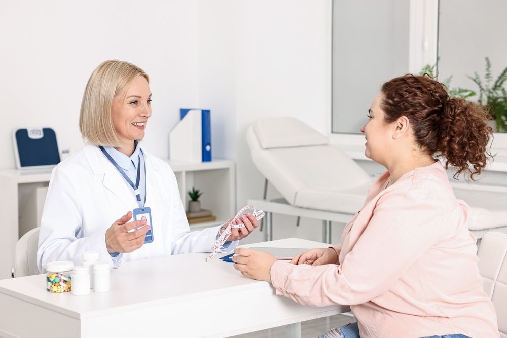 Doctor consulting with a patient in a bright clinic office