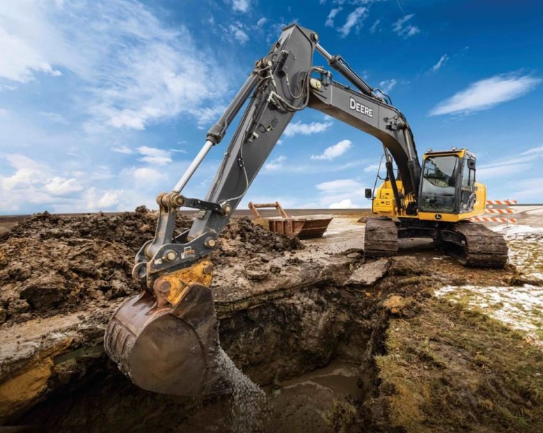 A large excavator is digging a hole in the ground.