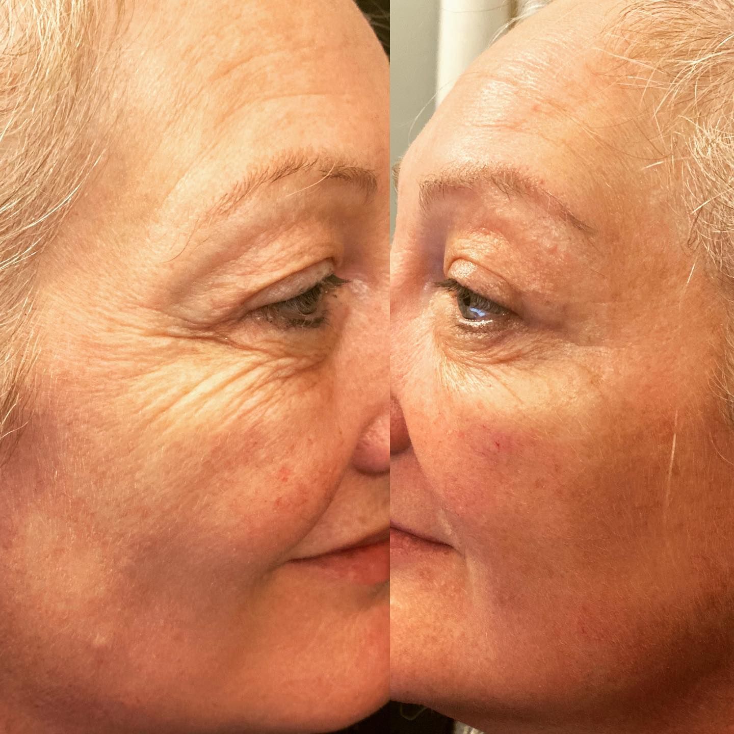 Close-up profile reflection of a woman facing her mirrored image, nose-to-nose with a slight smile