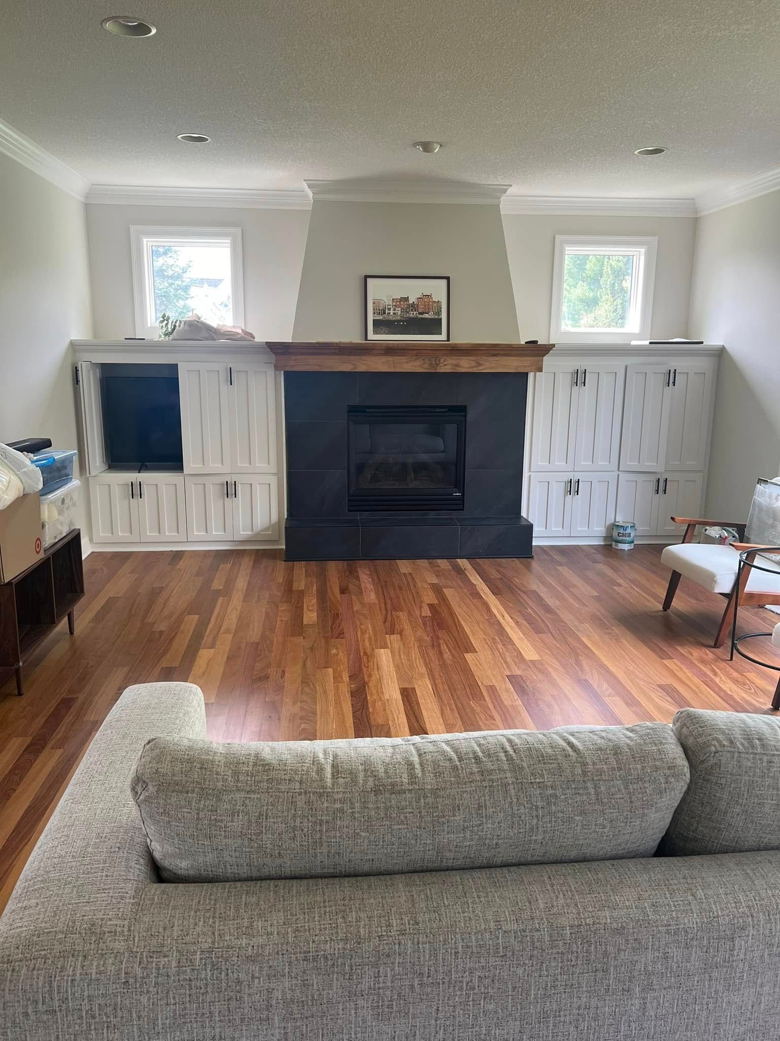 A living room with a fireplace and a couch.
