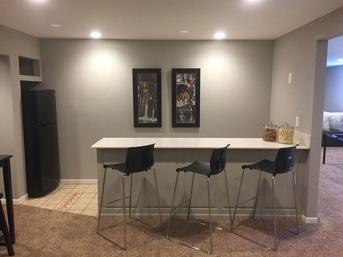 A room with a table and chairs in it