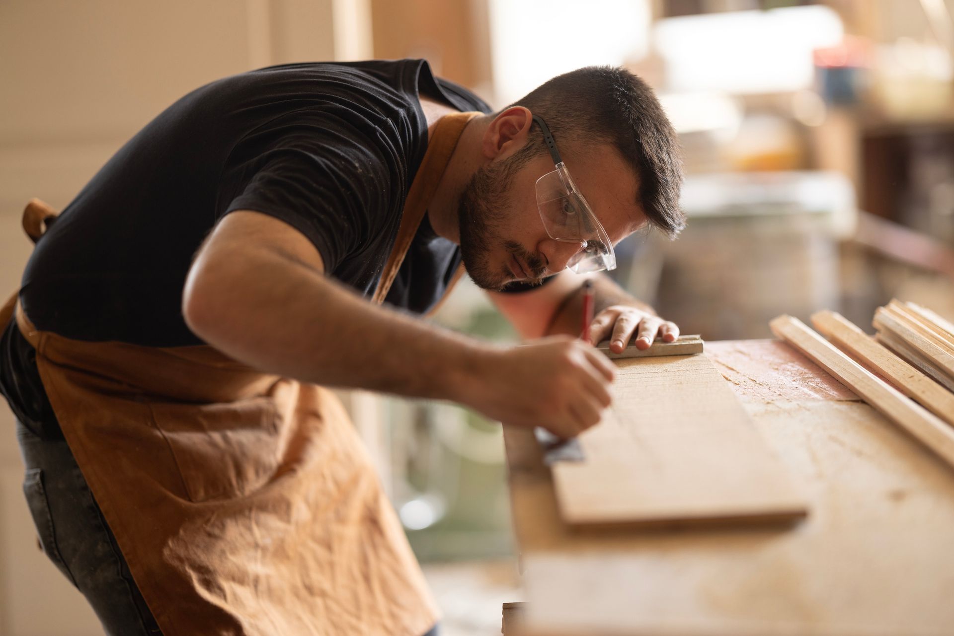 Carpenter shaping Tasmanian Oak Timber for use in a modern interior design project. Carpenter shaping Tasmanian Oak Timber for use in a modern interior design project.