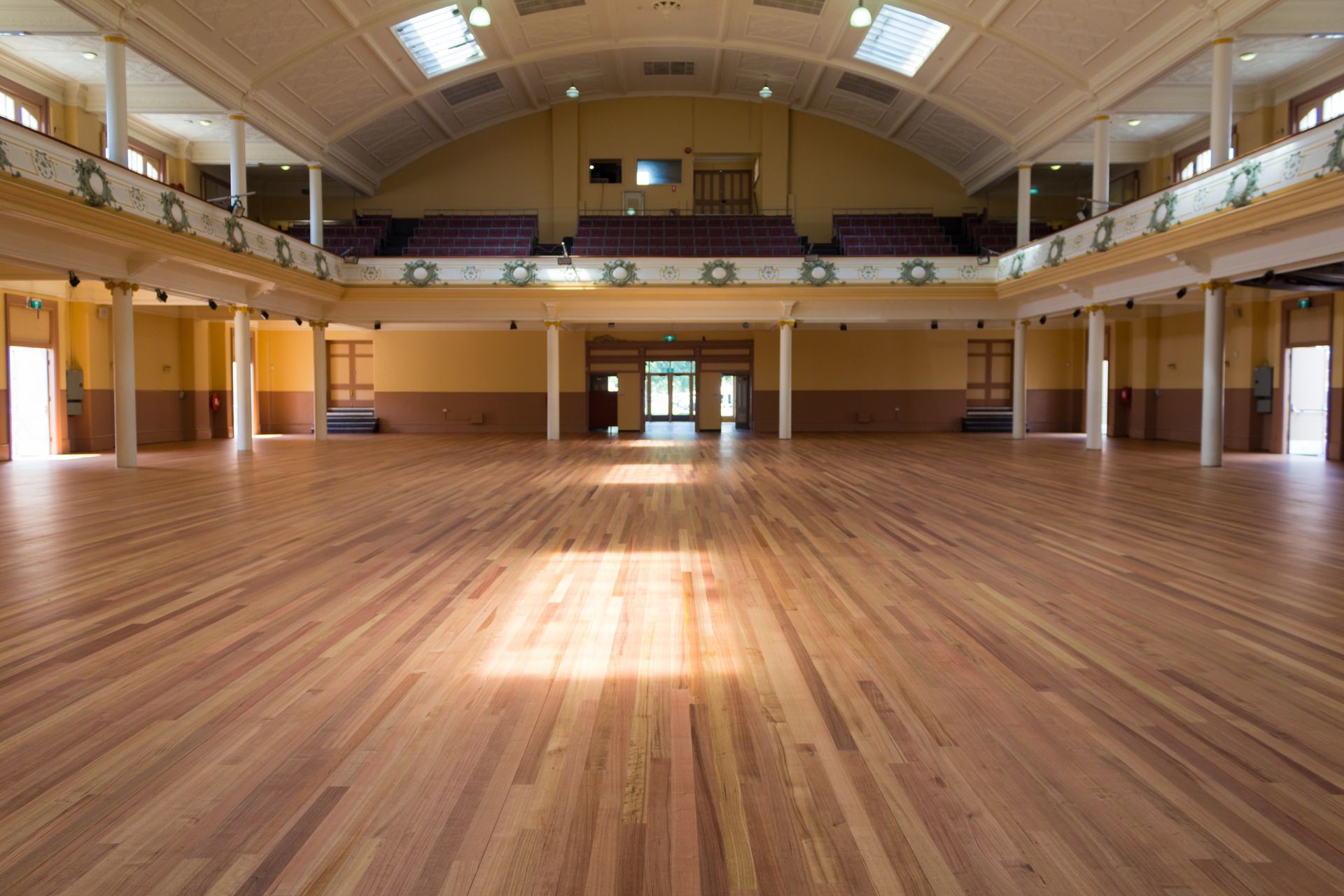 A large empty auditorium with a wooden floor
