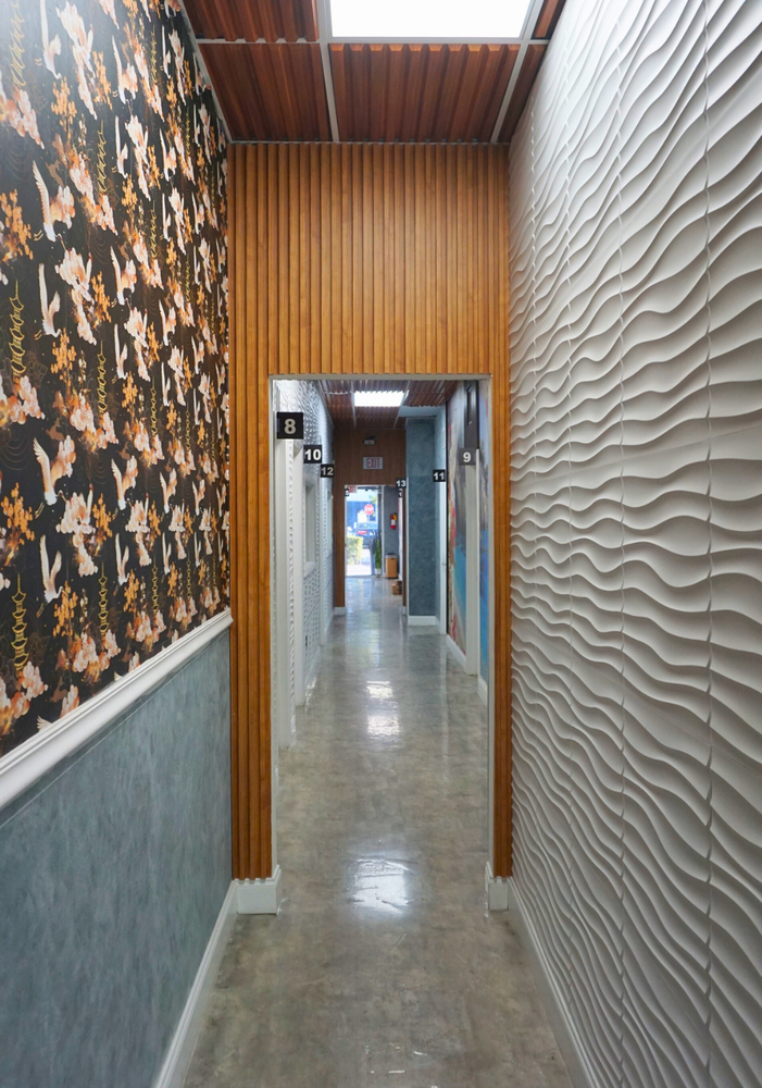 Interior hallway of salon suites for rent in North Miami with private beauty studio doors