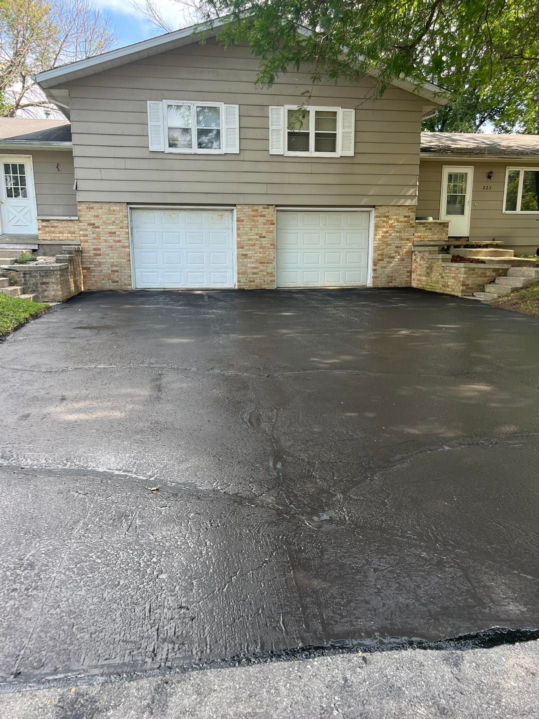 Two Garage Door and Asphalt Driveway
