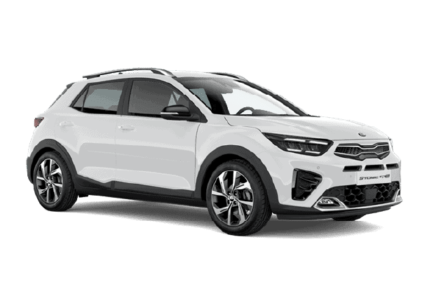 a row of cars are parked in a lot in front of a building .