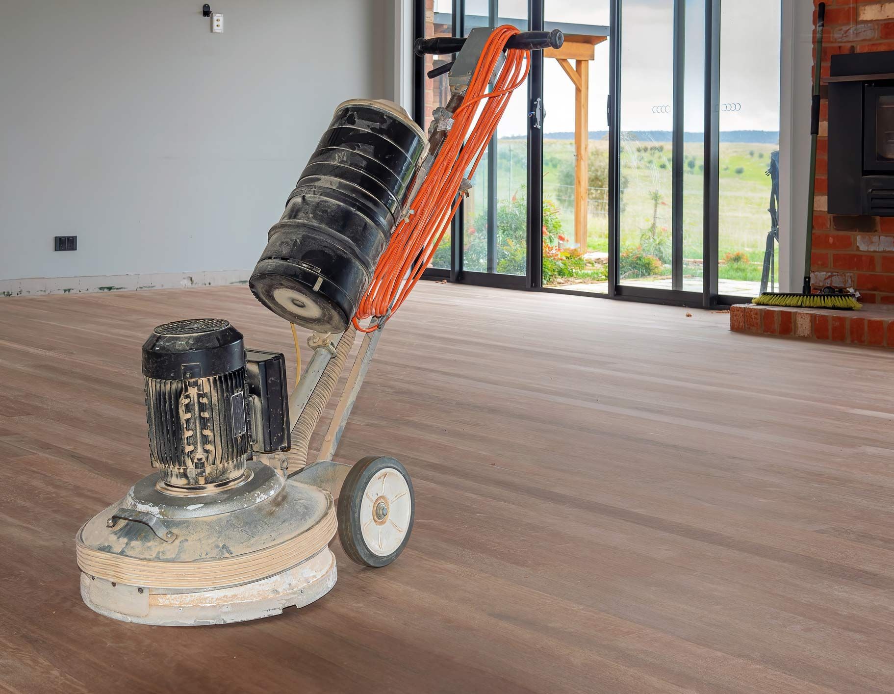 A Machine Is Sitting on A Wooden Floor | Gold Coast, QLD | Signature Sanding