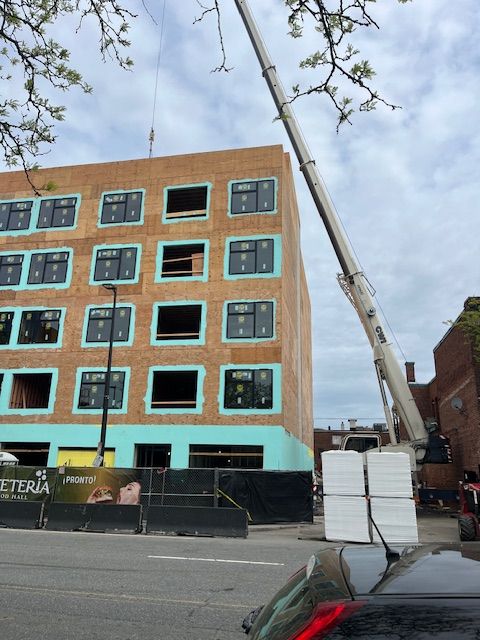 A brick house is being built with scaffolding around it.