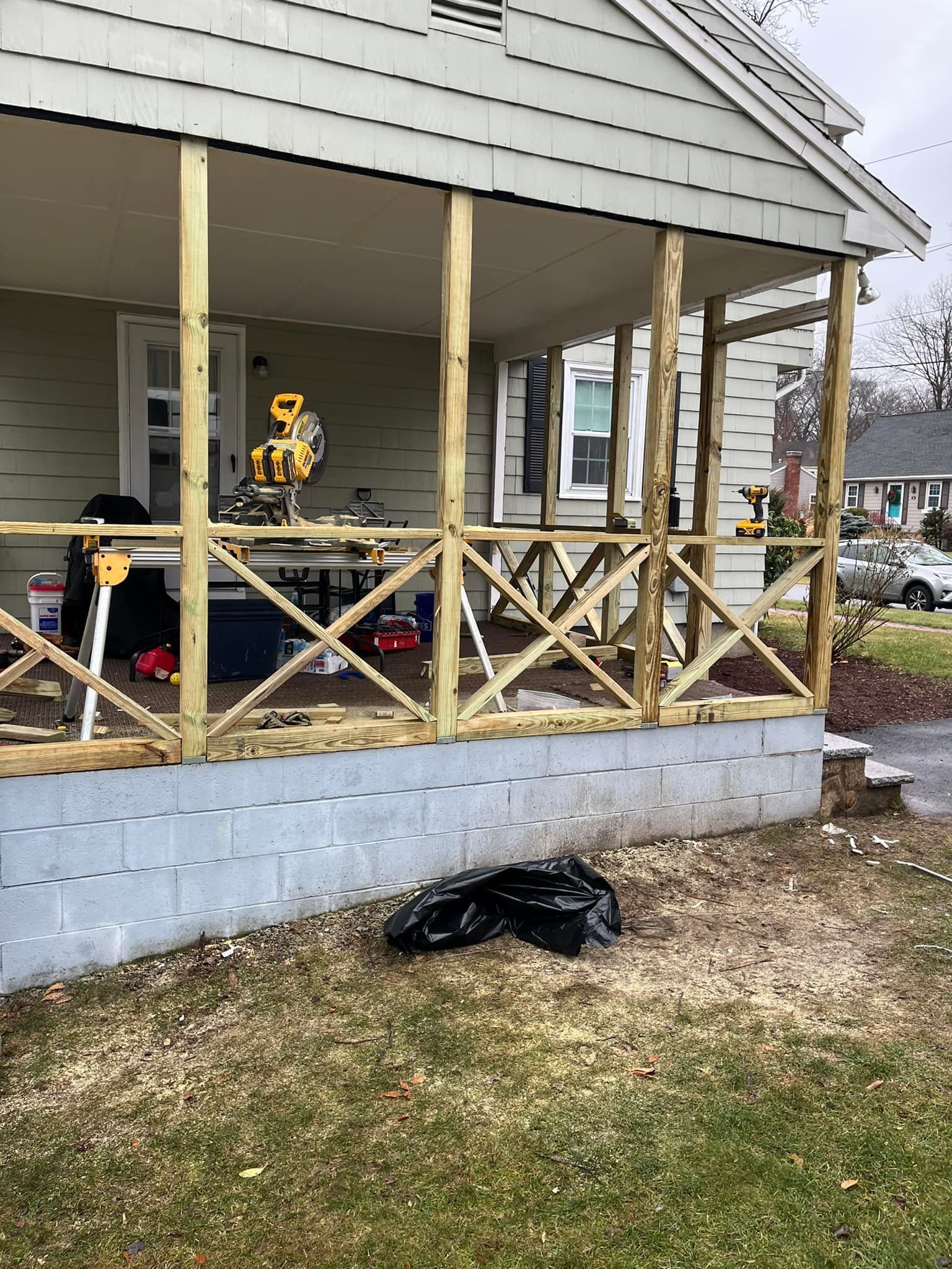 A porch is being built on the side of a house.