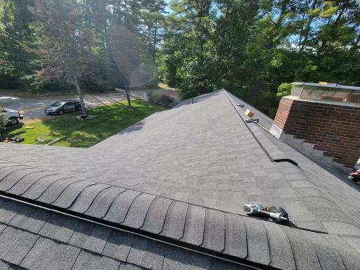 A before and after photo of a living room being remodeled.