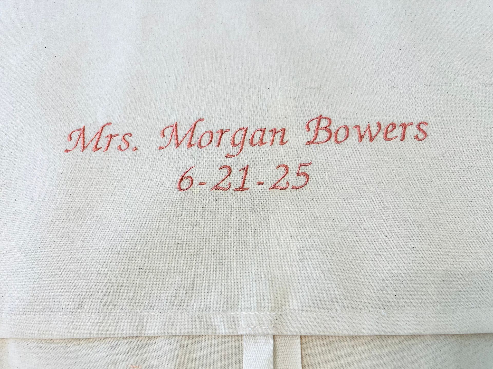 Embroidered text on fabric: 