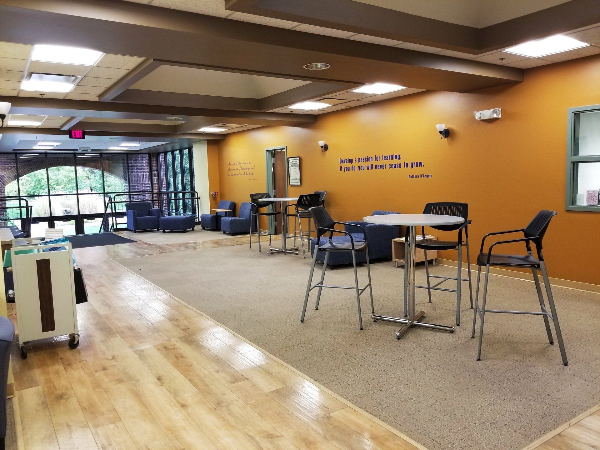 A large room with tables and chairs in it