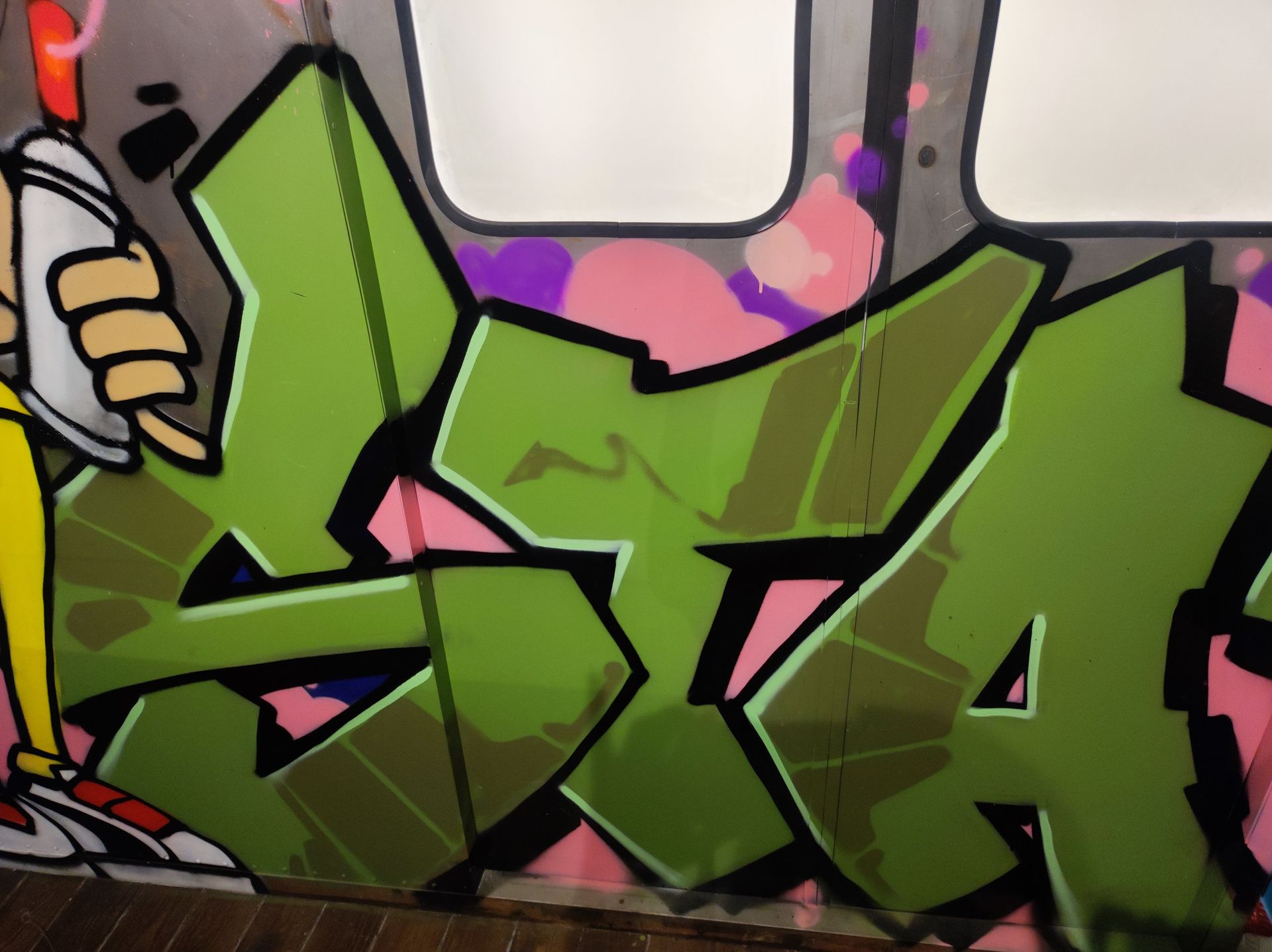 A close up of graffiti on a wall that says sta