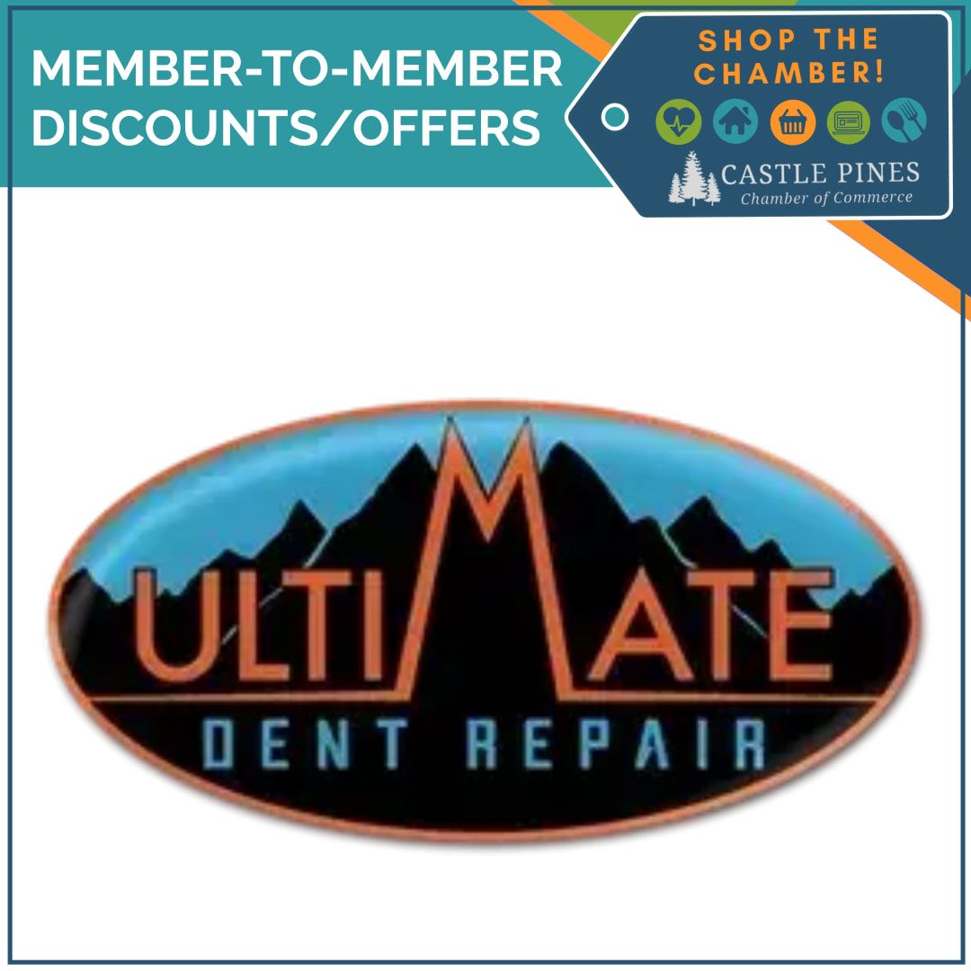 A logo for ultimate dent repair with a mountain in the background