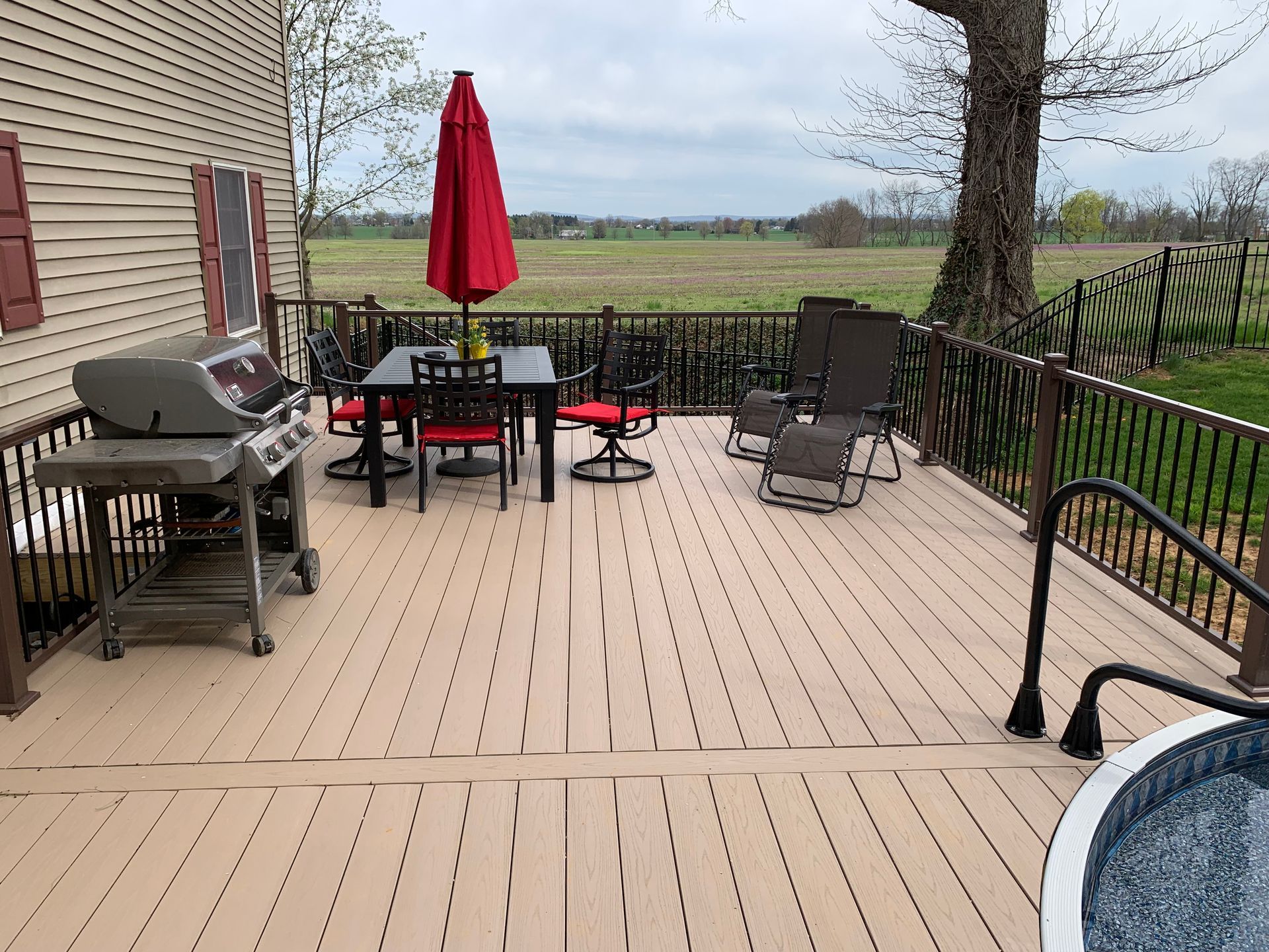 Remodeling Experts deck builder contractor custom deck along pool. Deck details... maintenance free composite decking with aluminum railing 