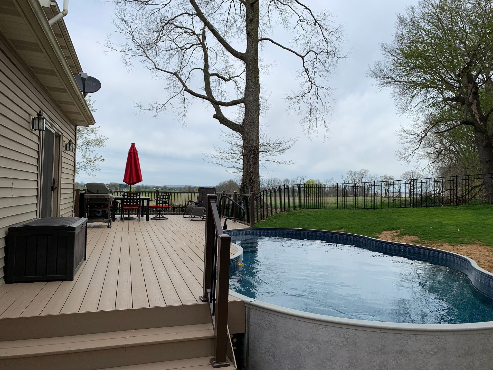 Remodeling Experts deck builder contractor custom deck along pool. Deck details... maintenance free composite decking with aluminum railing 