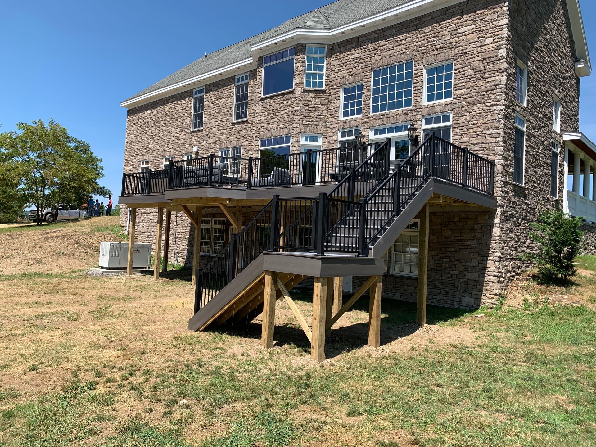 Remodeling Experts deck builder contractor custom maintenance free composite decking with aluminum railing