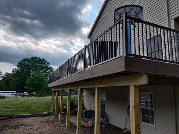 Remodeling Experts deck builder contractor custom deck along pool. Deck details... maintenance free composite decking with aluminum railing 