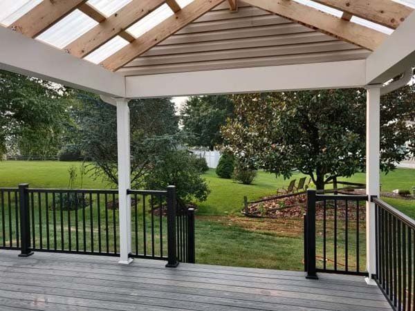 Remodeling Experts deck builder contractor custom deck shade roof. Deck details... maintenance free composite decking with aluminum railing 