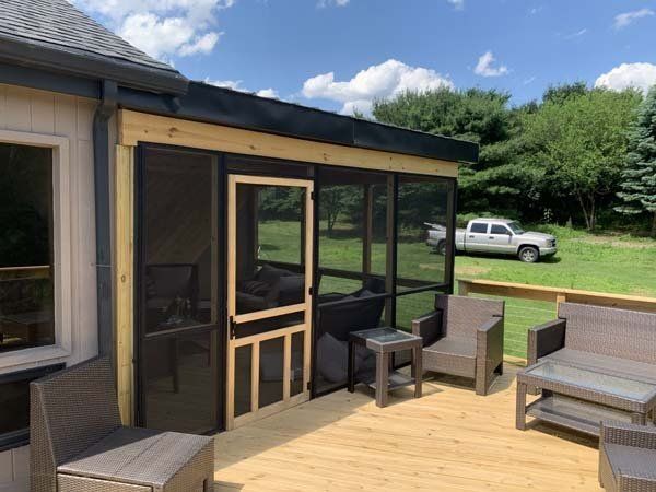 Remodeling Experts deck builder contractor custom deck along with screen in porch area.