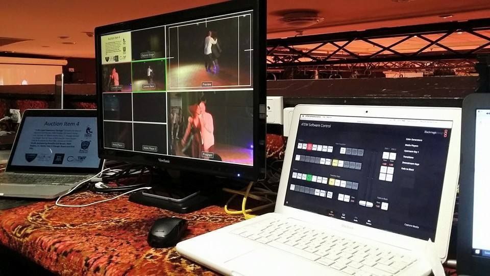 A Laptop is Sitting on a Table Next to a Monitor — Inspired Audio Visual in Coffs Harbour, NSW