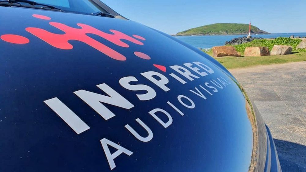A Black Van With the Word Inspired Audio Visual on the Side — Inspired Audio Visual in Coffs Harbour, NSW
