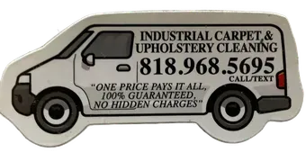 An industrial carpet and upholstery cleaning van with a phone number