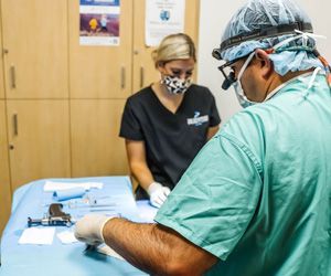 dr and nurse in hand and wrist procedure 