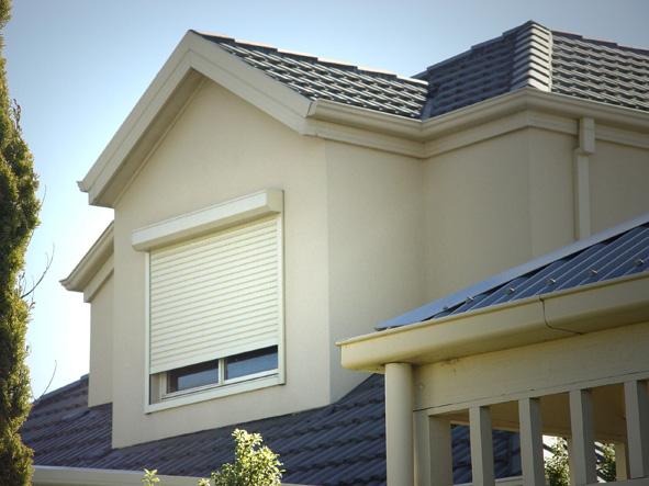 Rolling Shutters Brick House Windows Protection — Co-ordinations Blinds & Awnings in Falls Creek, NSW
