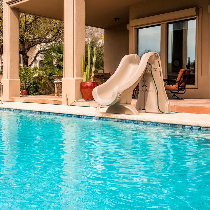 A Swimming Pool With a Small Slide at the Side - Madison, AL - Valley Pools