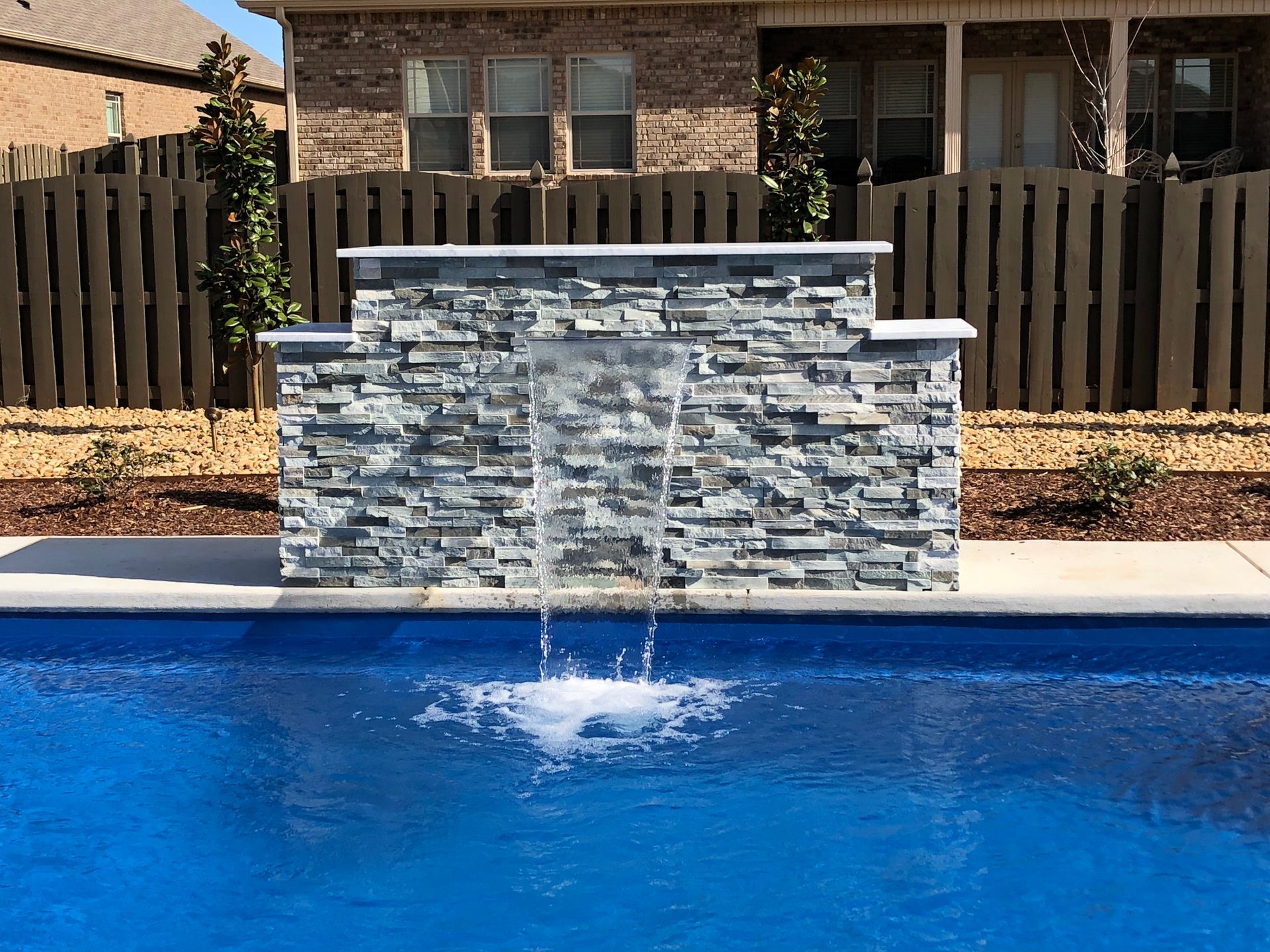 There is a waterfall in the middle of the pool. - Madison, AL - Valley Pools