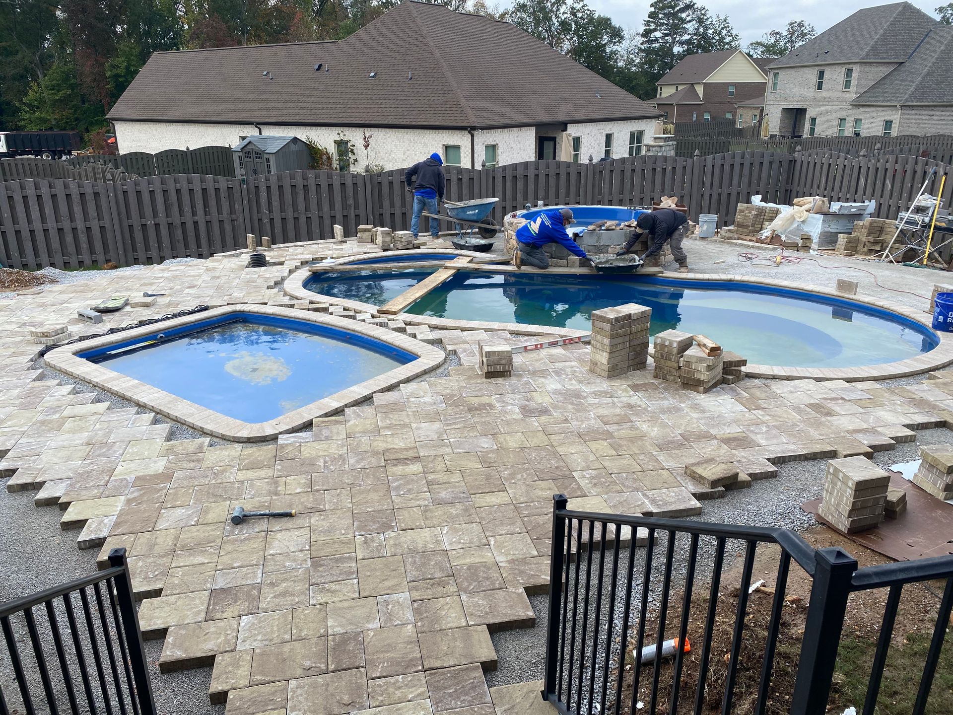 A large swimming pool is being built in a backyard. - Madison, AL - Valley Pools