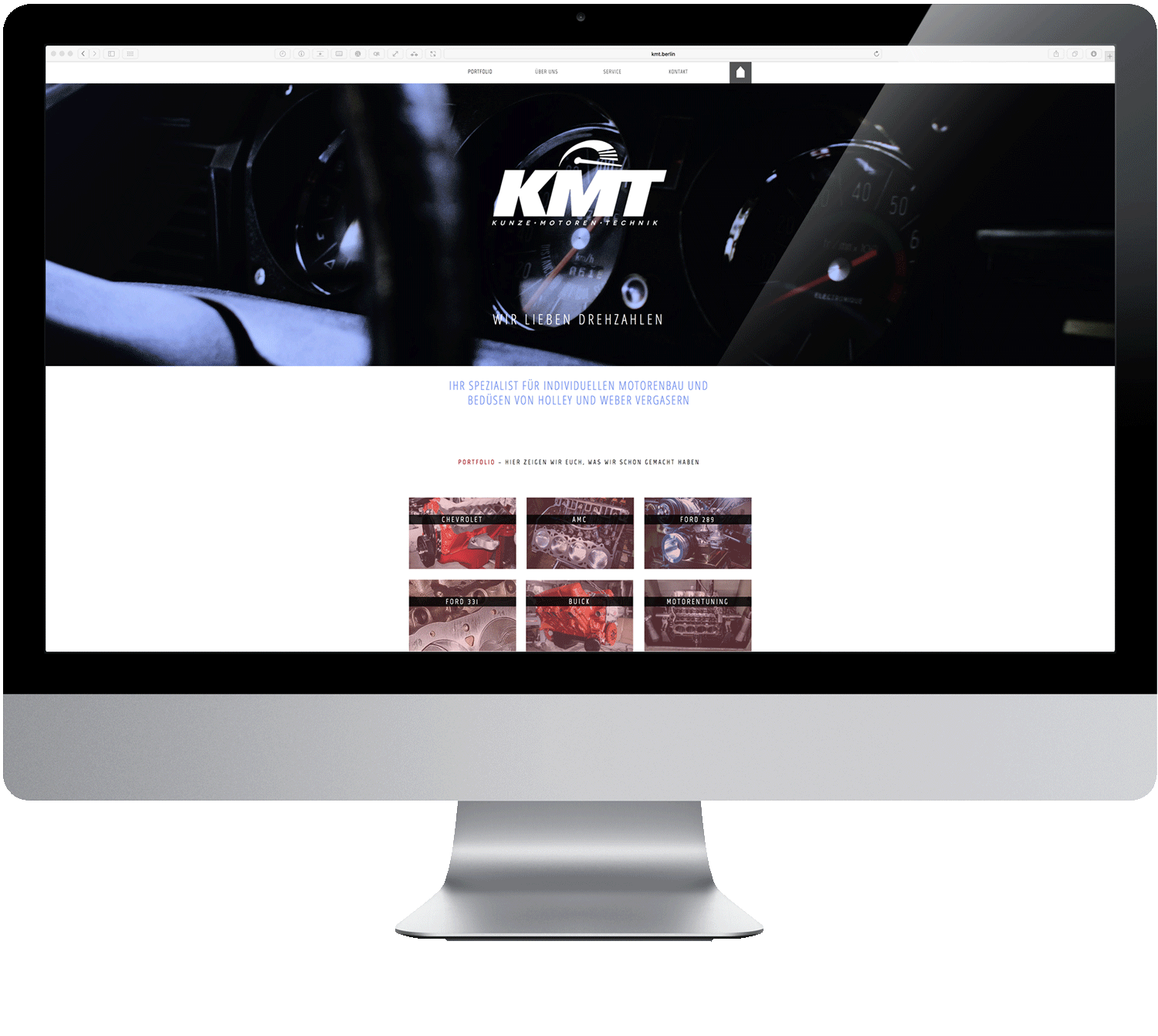 A computer monitor with a kmt website on it