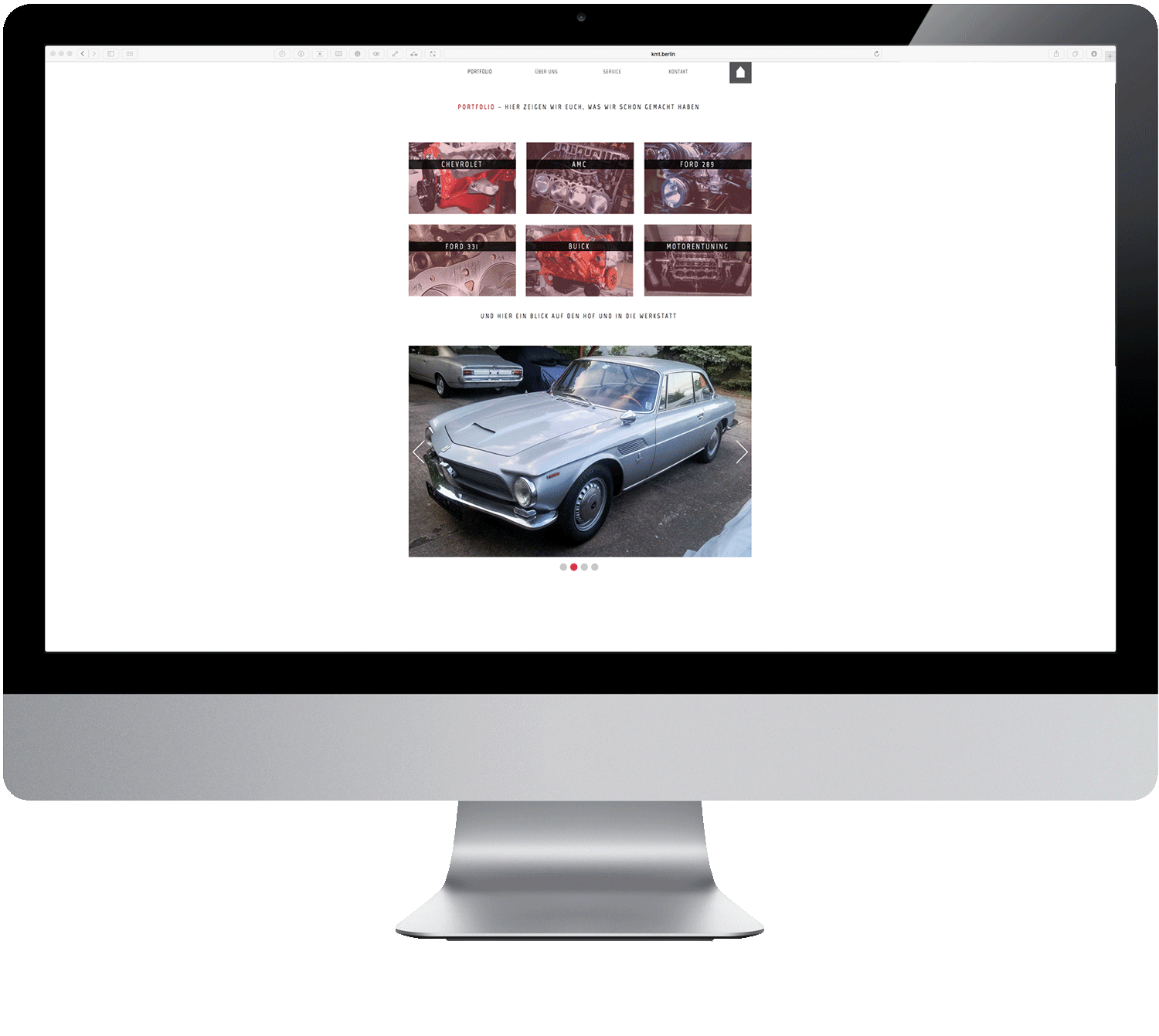 A computer monitor with a picture of a car on the screen