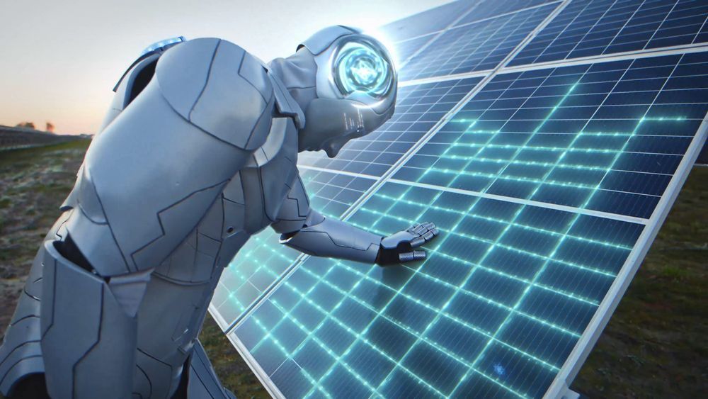 A robot is standing next to a solar panel.