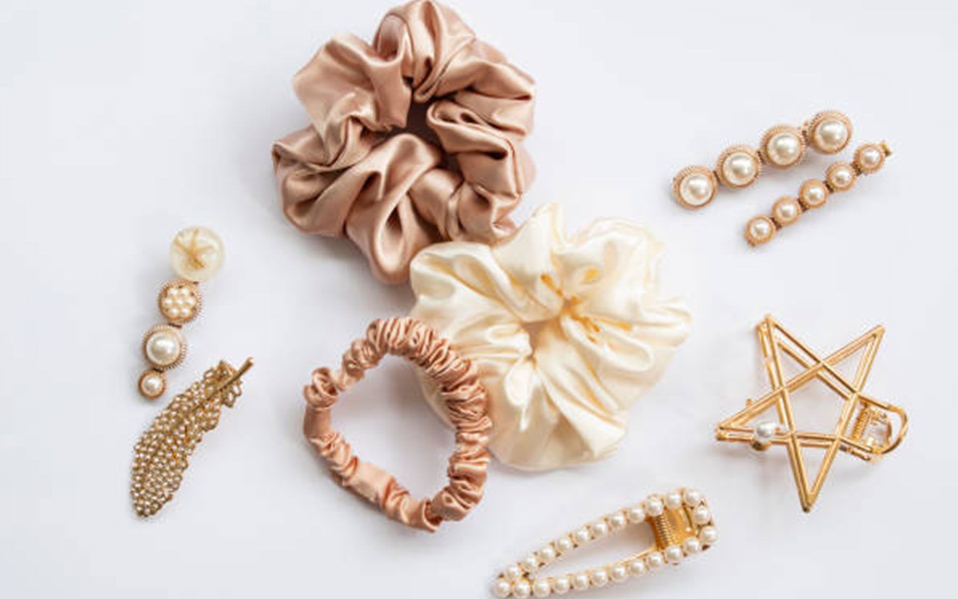 A bunch of hair accessories on a white surface.